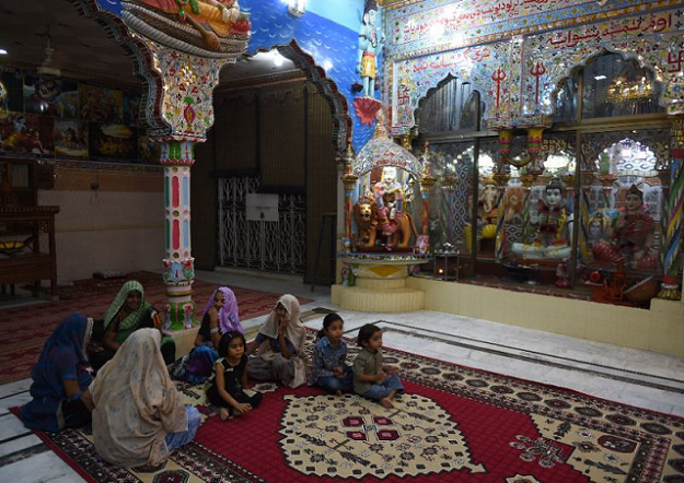 Hindu worshipers are seen praying. PHOTO: AFP