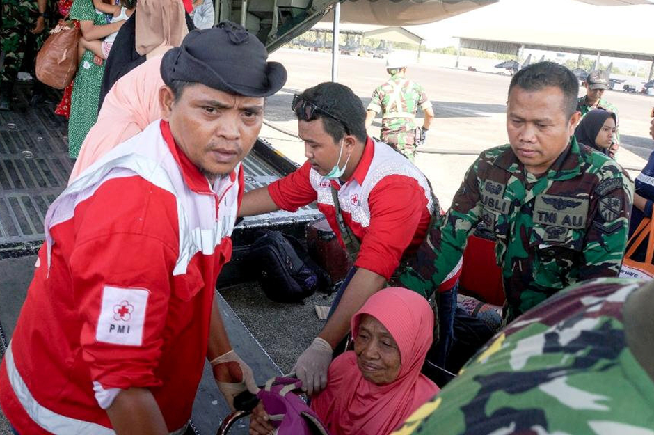 Ambulance and evacuation services are provided by Indonesia Red Cross for affected people at Sultan Hasanuddin Airport, Makassar, Indonesia. Reuters 