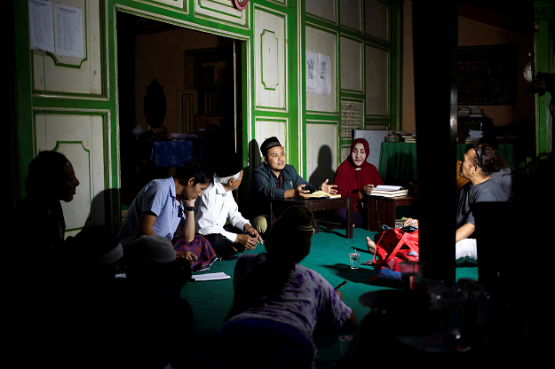 A group of transgender women listen to cleric Arif Nuh Safri at a Quran study session in Yogyakarta, Indonesia. PHOTO: REUTERS