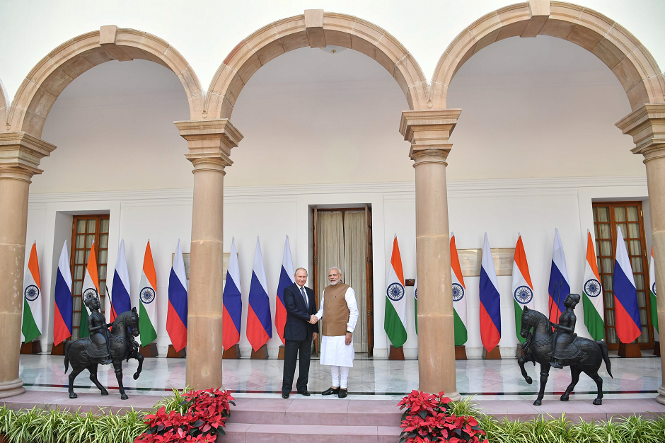AFP Russian President Vladimir Putin and Indian Prime Minister Narendra Modi pose for photographers ahead of their meeting at Hyderabad House in New Delh