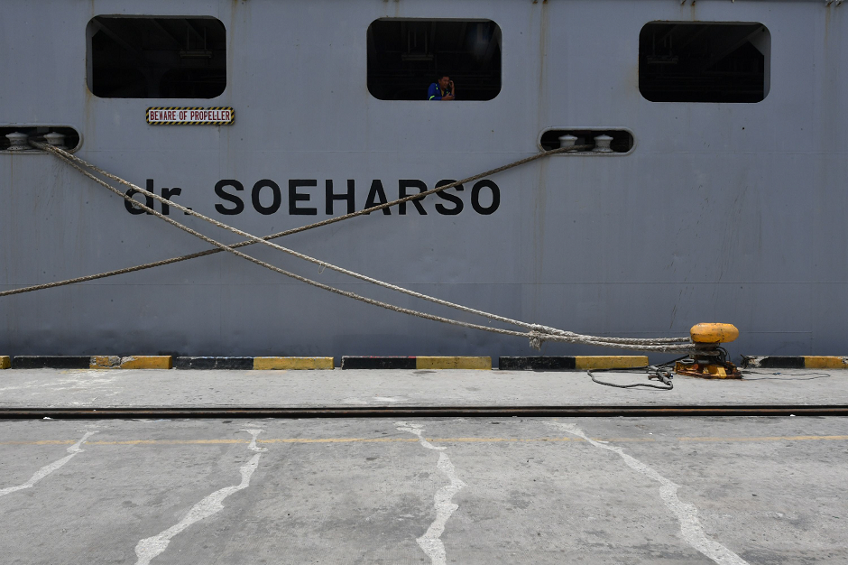An Indonesian is seen through a port hole of the floating hospital KRI Soeharso operated by Indonesian Navy in Palu AFP