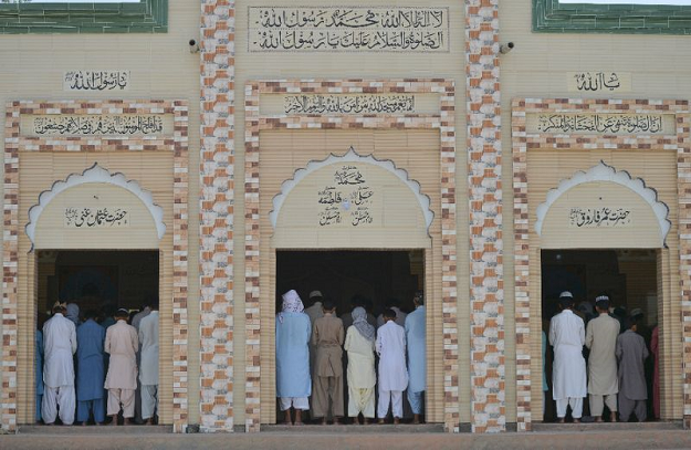 Muslim worshipers are seen praying at a mosque in Mithi. PHOTO: AFP