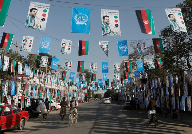 Election posters of parliamentarian candidates are installed during the elections campaign in Kabul. PHOTO: REUTERS