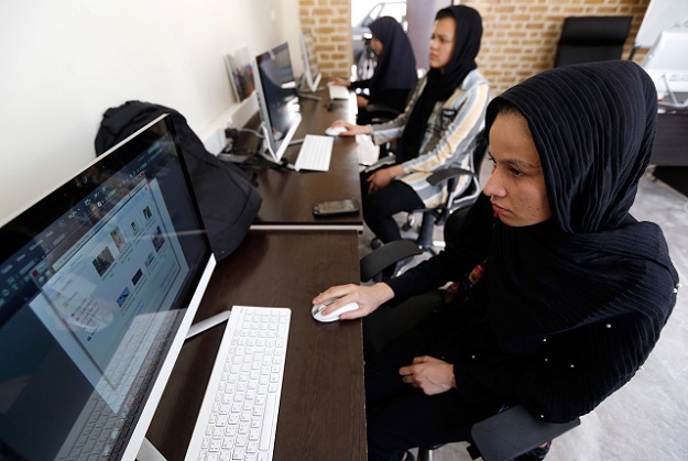 1.Students stare at desktops as they study at the ILIA charity complex that caters to hundreds of struggling families and Afghan refugees in the Iranian capital of Tehran, on September, 11, 2018. - This centre is run by the ILIA Foundation, founded a decade ago by social workers and wealthy businessmen who have partnered with UN refugee and health agencies to help around 1,000 families from deprived backgrounds.  PHOTO: AFP