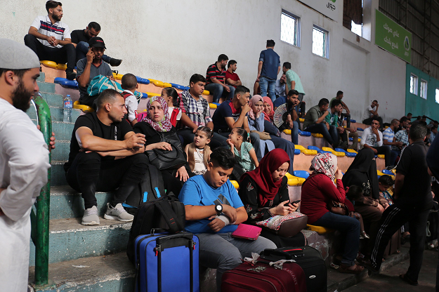Palestinians wait to travel to Egypt through the Rafah border crossing in the southern Gaza Strip, on September 26, 2018. PHOTO: AFP