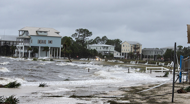 Waves continue to pound the community of Shell Point in Crawfordville, Florida. PHOTO AFP