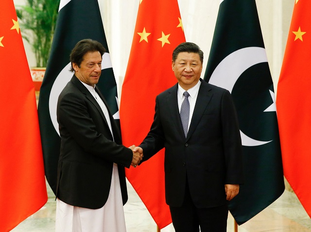 china 039 s president xi jinping shakes hands with prime minister imran khan ahead of their meeting at the great hall of the people in beijing on november 2 2018 photo afp