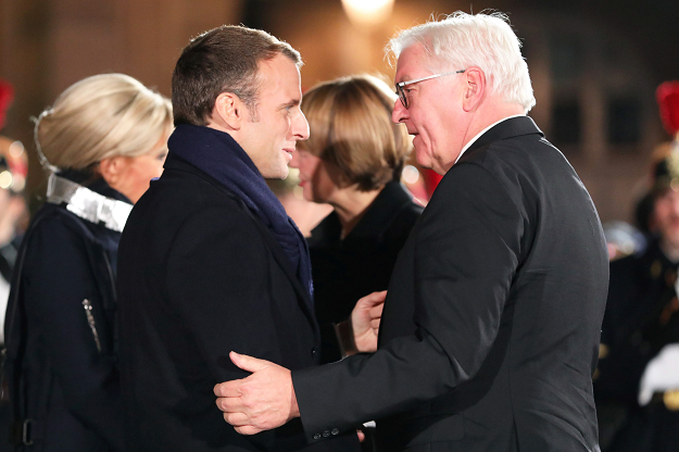French President Emmanuel Macron  welcomes German President Frank-Walter Steinmeier in front of Notre-Dame Cathedral