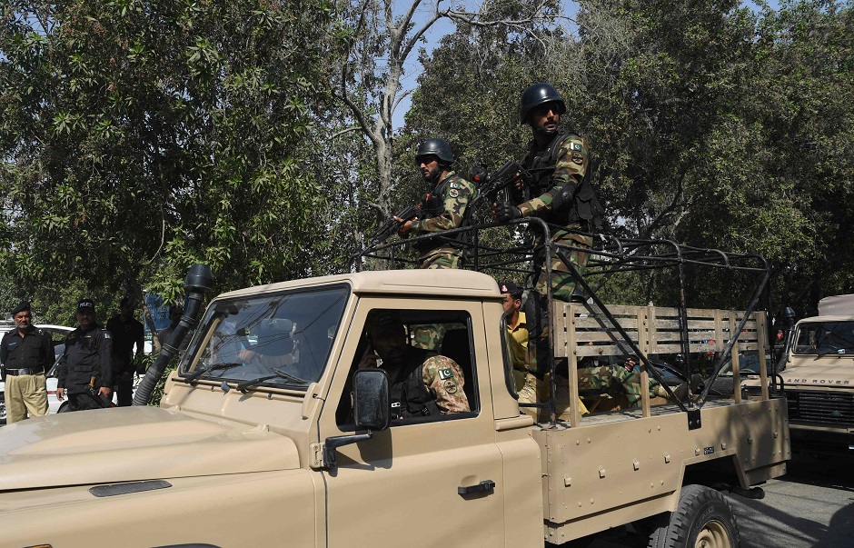 Pakistani army soldiers patrol at the Chinese consulate . PHOTO: AFP