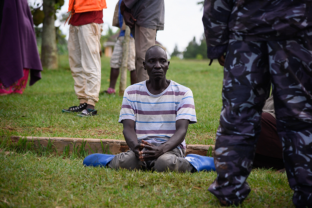 A man sits at the rescue site of capsized cruise boat on lake Victoria at Mutima village. PHOTO: AFP