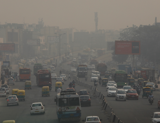 Vehicles drive through smog in New Delhi, India, November 8, 2018. REUTERS