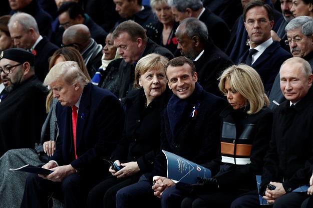  Russian President Vladimir Putin, Brigitte Macron, French President Emmanuel Macron, German Chancellor Angela Merkel, U.S. President Donald Trump, first lady Melania Trump (hidden), and Morocco's King Mohammed VI attend a commemoration ceremony for Armistice Day, 100 years after the end of the First World War at the Arc de Triomphe in Paris, France PHOTO: REUTERS
