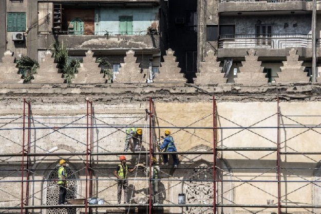 Work on Cairo's 13th-century al-Zahir Baybars mosque in the neglected Islamic quarter resumed last month after being halted during the turmoil that followed the ouster of the dictator Hosni Mubarak in 2011. PHOTO AFP