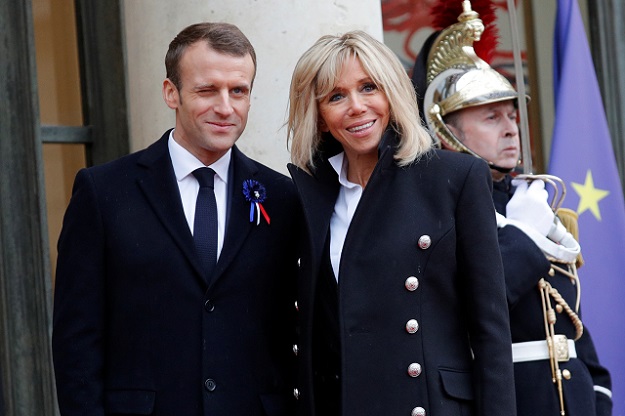  French President Emmanuel Macron and his wife Brigitte Macron pose at the Elysee Palace as part of the commemoration ceremony for Armistice Day, 100 years after the end of the First World War, in Paris, France, November 11, 2018. PHOTO: REUTERS
