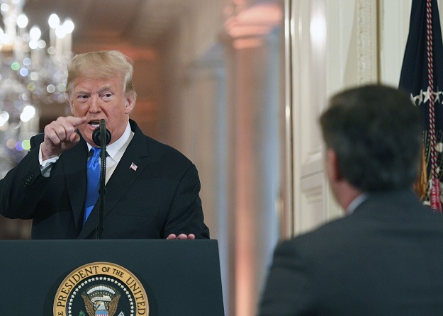 US President Donald Trump points to journalist Jim Acosta from CNN during a post-election press conference in the East Room of the White House in Washington, DC on November 7, 2018. PHOTO: AFP