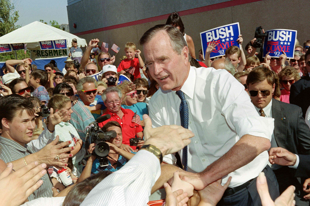 US President George Bush shakes hands with supporters upon his arrial in Reno. PHOTO: AFP