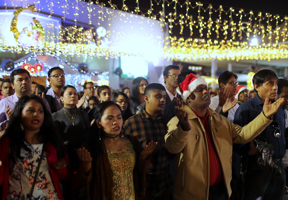  Members of the Christian expatriate community attend a mass on Christmas eve at Santa Maria Church in Dubai. PHOTO: REUTERS
