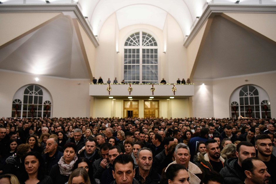 Worshippers attend the Christmas Mass celebrations at a church in the town of Gjakova, Western Kosovo. PHOTO: AFP