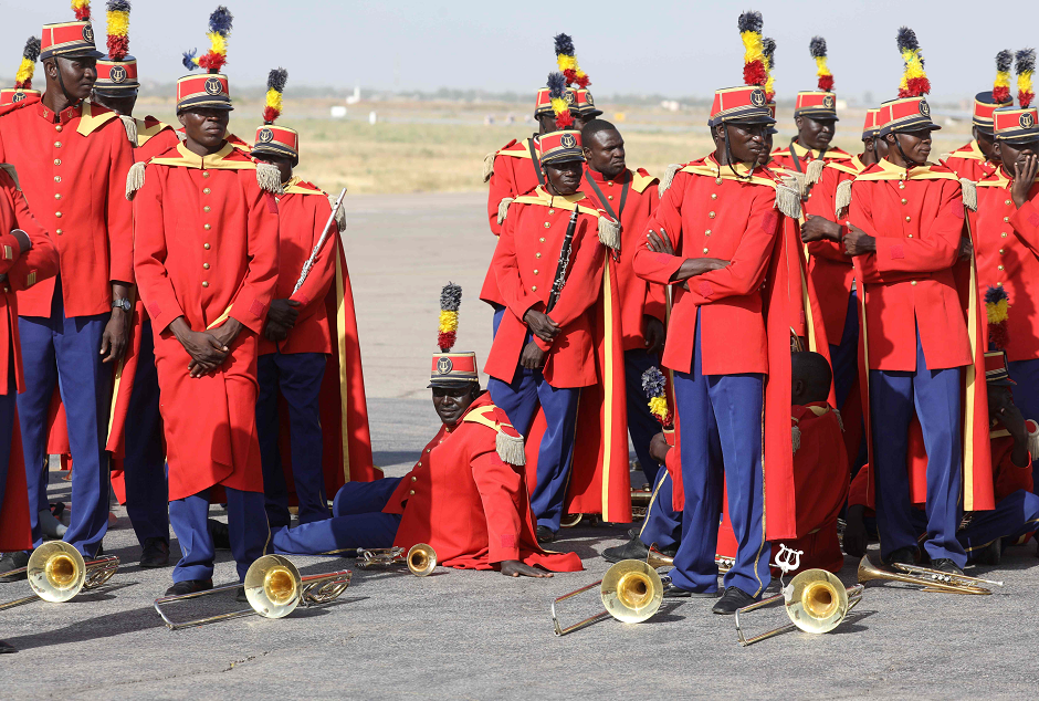 Chad's fanfare soldiers wait for French president's arrival at the international airport of N'Djamena on December 22, 2018. PHOTO: AFP