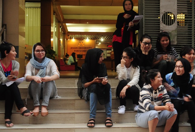 Formin Akter, center, talks to new friends at the Asian University for Women. PHOTO: REUTERS