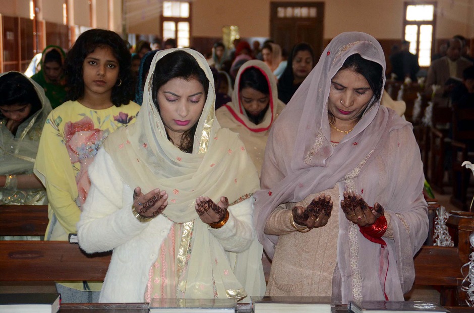 Christian women pray on the Christmas Day at the Methodist Church in Quetta, Baluchistan. PHOTO COURTESY: PPI/IMAGES