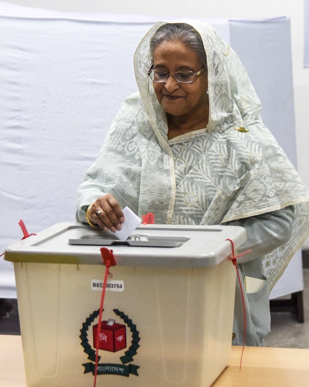 Bangladeshi Prime Minister Sheikh Hasina casts her vote at a polling station in Dhaka. PHOTO: AFP