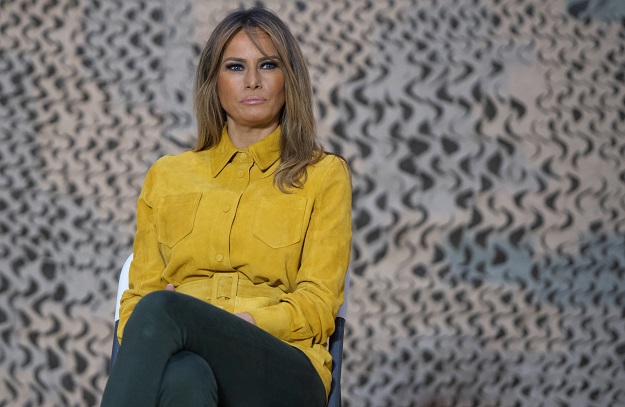 First Lady Melania Trump sits onstage as US President Donald Trump speaks to members of the US military during an unannounced trip to Al Asad Air Base  PHOTO: AFP