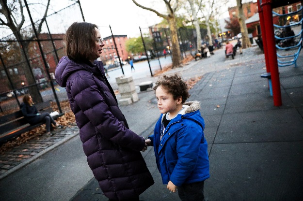 Reuters' US Health Editor Michele Gershberg talks with her son Natan in a park in Brooklyn, New York City, US. PHOTO: REUTERS