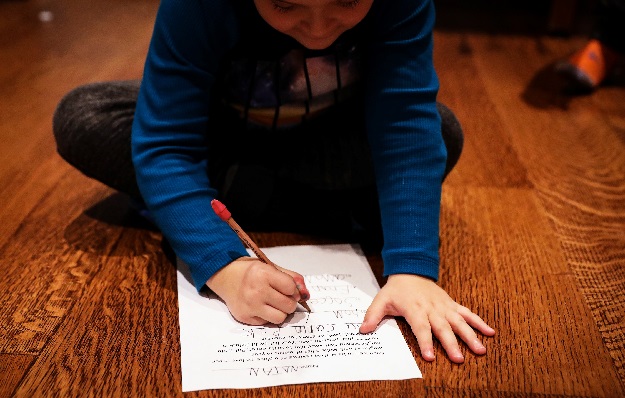 Natan, the son of Reuters' US Health Editor Michele Gershberg, works on his homework in Brooklyn, New York City, US. PHOTO: REUTERS