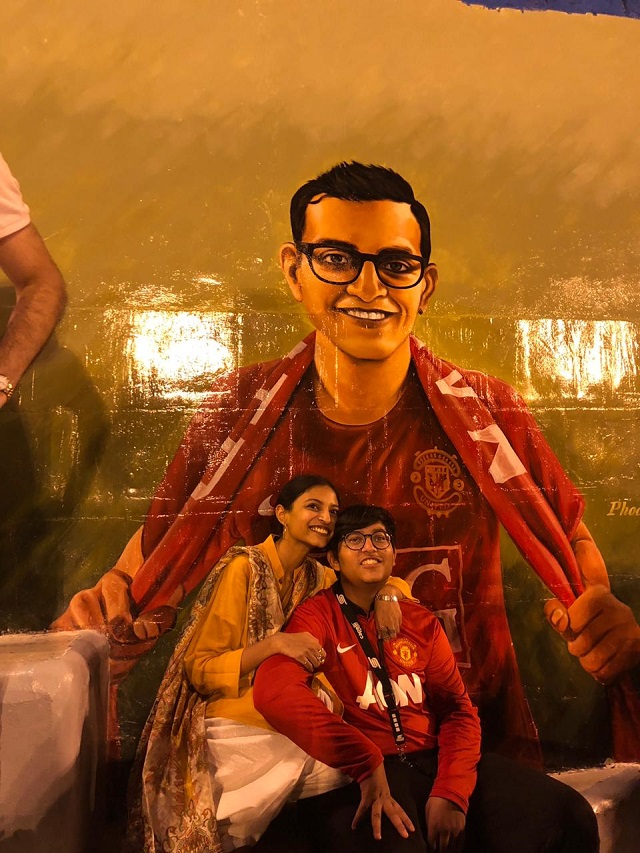 Emad's siblings, proud to carry on his legacy, pose in front of a painted mural of him at the academy grounds. PHOTO: EXPRESS