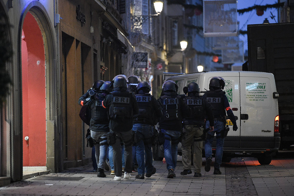 Members of the French special forces BRI (Research and Intervention Brigade - Brigades de recherche et d'intervention) conduct searches on December 12, 2018 for the gunman who opened fire near a Christmas market in Strasbourg, eastern France, the night before. PHOTO: AFP