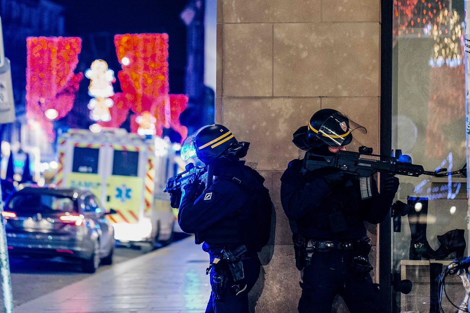 French police officers stand guard near the scene of a shooting on December 11, 2018 in Strasbourg, eastern France. PHOTO: AFP
