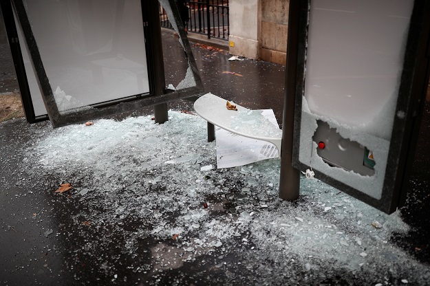 A vandalized bus stop is seen the morning after clashes PHOTO: REUTERS