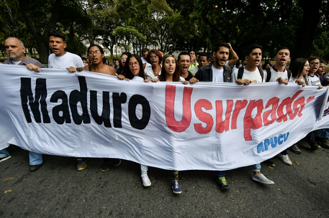 students of venezuela 039 s central university ucv in caracas hold a banner reading quot maduro usurper quot during a protest against the government of president nicolas maduro photo afp