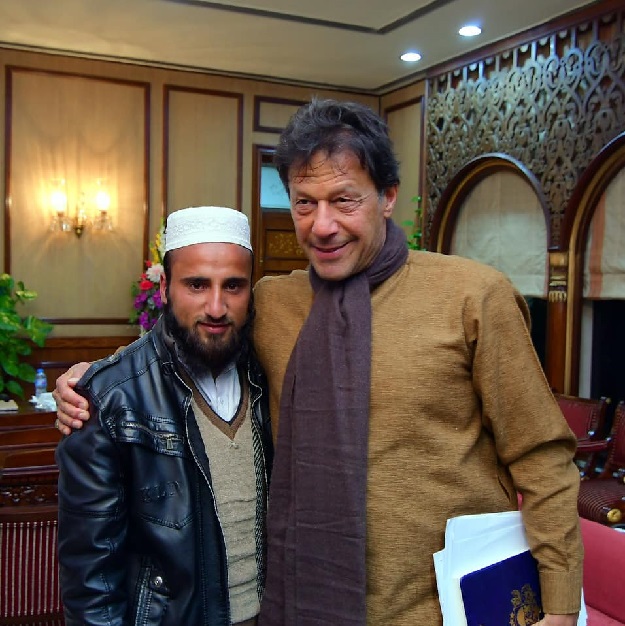 polio worker irfanullah with pm imran khan photo express