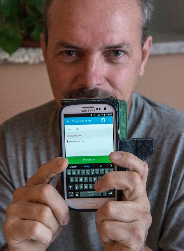 Vlastimil Gular, who lost his larynx and his voice after a cancer, speaks in his own voice via a mobile phone using the special app to type in what he wants to say, during an interview with AFP journalists on November 13, 2018 at his home in the village of Mlada Vozice. PHOTO: AFP