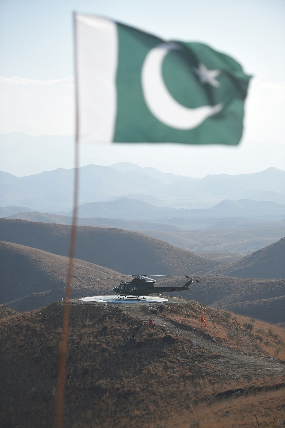 A Pakistani army helicopter is seen at an heliport at a border terminal in Ghulam Khan, a town in North Waziristan. PHOTO: AFP