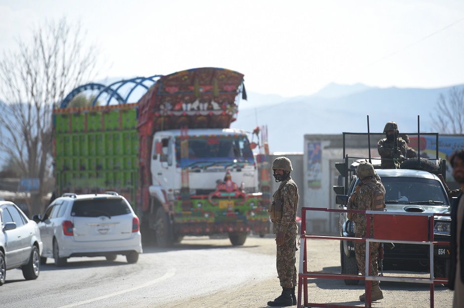  Pakistani army soldiers stand guard at a check point in Miran Shah , a town in North Waziristan. PHOTO: AFP