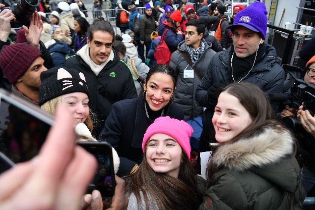 US Representative Alexandria Ocasio-Cortez (D-NY) poses for a photo with marchers as she attends the Women's March in New York. PHOTO: AFP