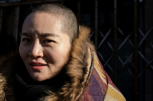 Wang Quanzhang's wife Li Wenzu shaved her head to protest against his detention. PHOTO: AFP