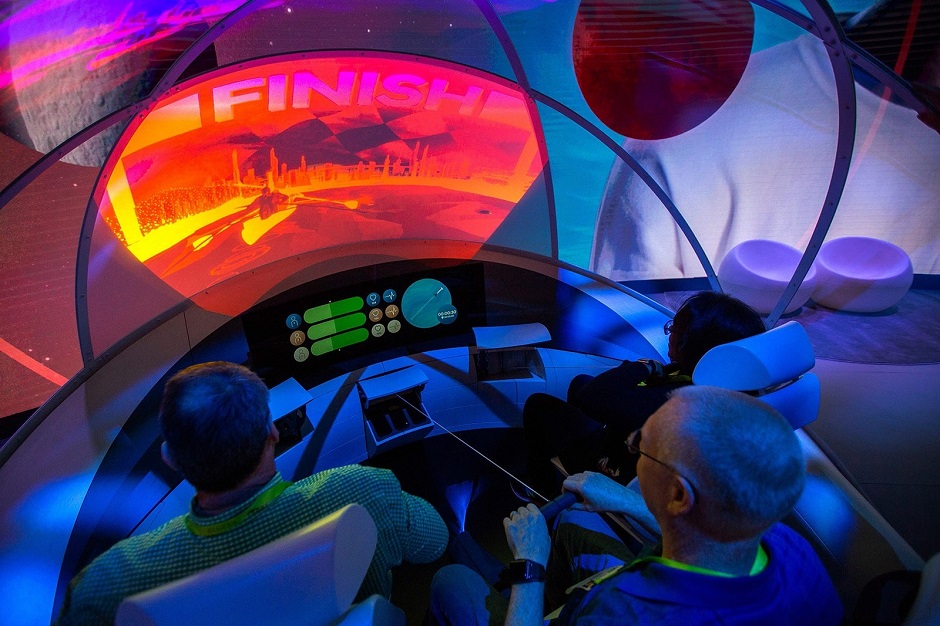 People practice rowing in a demonstration of the Hyundai My I.A. system of passenger entertainment in autonomous vehicles at CES International in Las Vegas. PHOTO: AFP