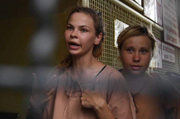 Anastasia Vashukevich, pictured left with another unidentified detainee in Thailand, has claimed to know secrets about alleged Russian meddling in the 2016 US election. PHOTO: AFP