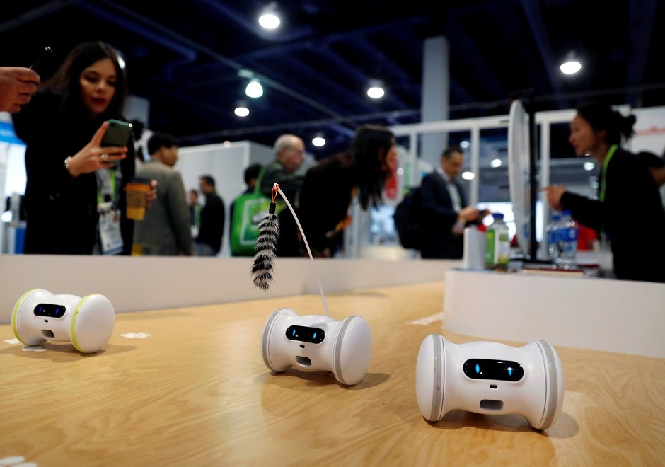 Pet fitness robots, which move automatically or are controlled with a smartphone, are displayed at the Varlam booth at CES International in Las Vegas. PHOTO: REUTERS