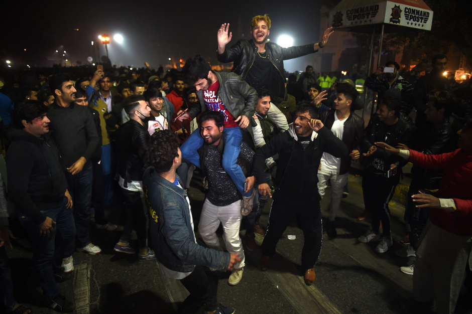 People watch the fireworks display during the New Year celebrations in Rawalpindi. PHOTO: AFP
