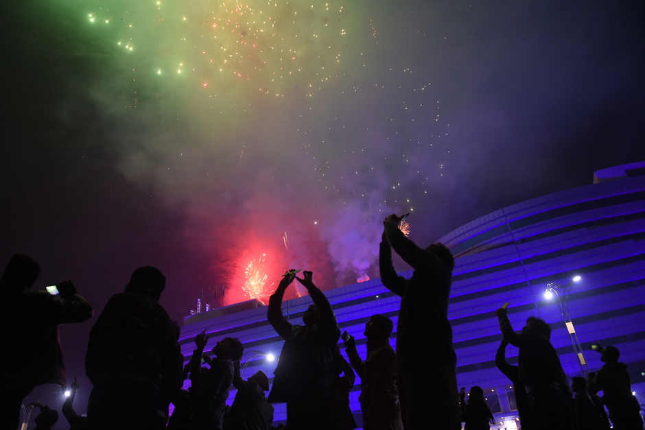 People watch the fireworks display during the New Year celebrations in Rawalpindi. PHOTO: AFP 