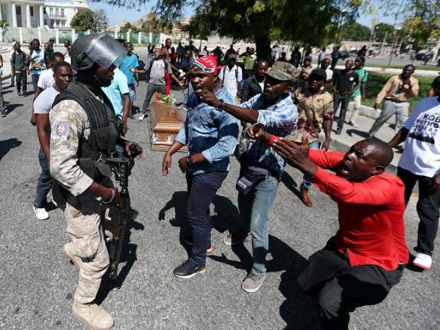 Haiti police fire rubber pellets at mourners as protests resume