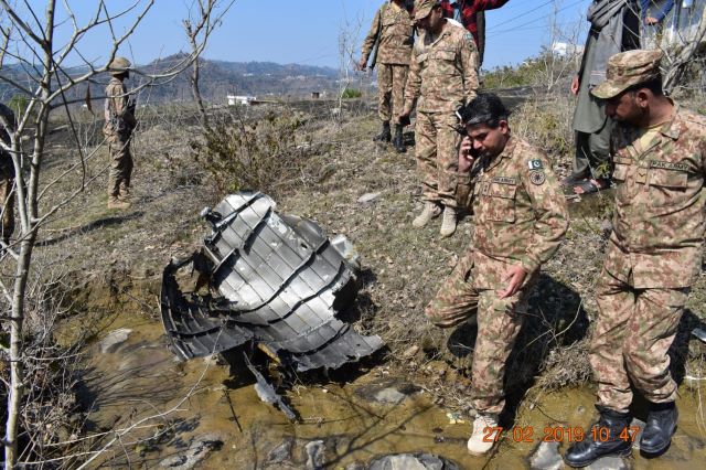 Pakistan Army inspects wreck of IAF aircraft. -EXPRESS