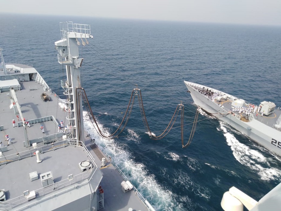PNS Saif being refueled while underway at sea.