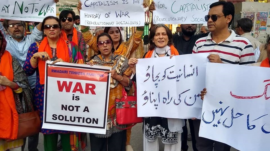 Civil society activists outside the Karachi Press Club (KPC) call for an end to the ongoing war-mongering and jingoism by Indian and Pakistani media. PHOTO: MUHAMMAD SALMAN KHAN