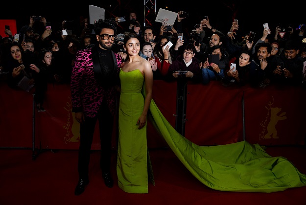 Indian Bolywood actor Ranveer Singh and British actress Alia Bhatt pose on the red carpet before the premiere of the film 